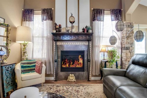 3 Legacy Cove, Sylvan Lake, AB - Indoor Photo Showing Living Room With Fireplace