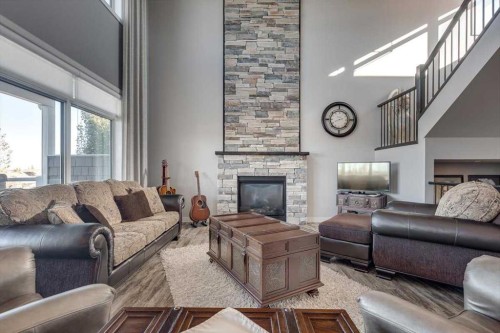 5 Leonard Close, Sylvan Lake, AB - Indoor Photo Showing Living Room With Fireplace