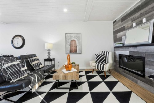 6 Metcalf Way, Lacombe, AB - Indoor Photo Showing Other Room With Fireplace