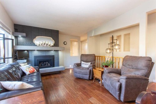 4413 Embury Crescent, Red Deer, AB - Indoor Photo Showing Living Room With Fireplace