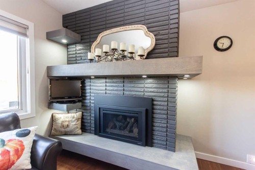 4413 Embury Crescent, Red Deer, AB - Indoor Photo Showing Living Room With Fireplace