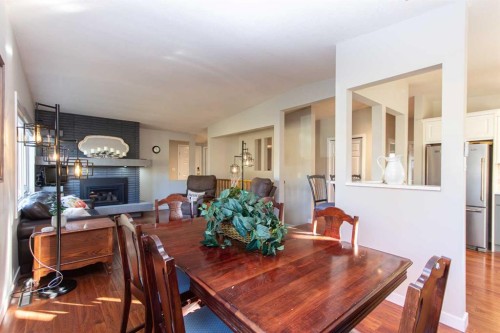 4413 Embury Crescent, Red Deer, AB - Indoor Photo Showing Dining Room With Fireplace