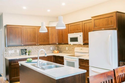 5013 57 Street, Stettler, AB - Indoor Photo Showing Kitchen With Double Sink