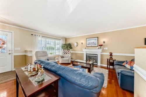 4514 54A Ave Cres, Innisfail, AB - Indoor Photo Showing Living Room With Fireplace