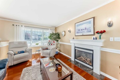 4514 54A Ave Cres, Innisfail, AB - Indoor Photo Showing Living Room With Fireplace