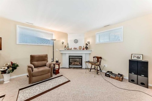 4514 54A Ave Cres, Innisfail, AB - Indoor Photo Showing Living Room With Fireplace