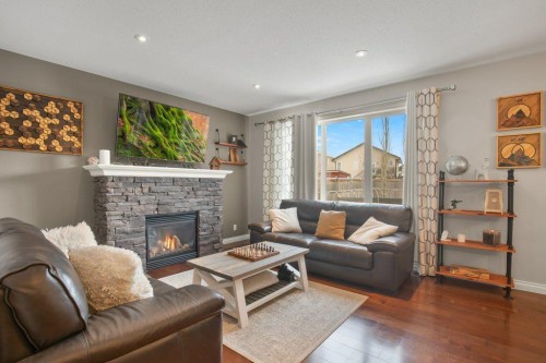 125 Traptow Close, Red Deer, AB - Indoor Photo Showing Living Room With Fireplace