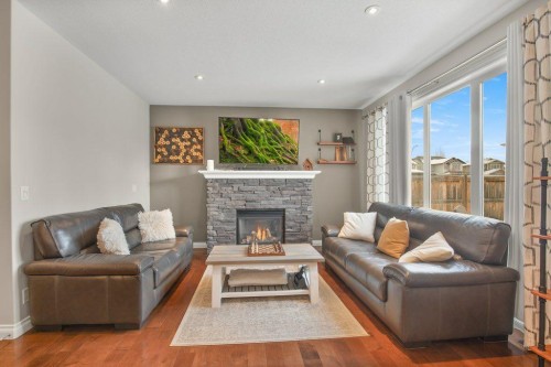 125 Traptow Close, Red Deer, AB - Indoor Photo Showing Living Room With Fireplace