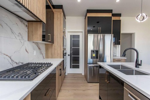 17 Thatcher Avenue, Red Deer, AB - Indoor Photo Showing Kitchen With Double Sink With Upgraded Kitchen