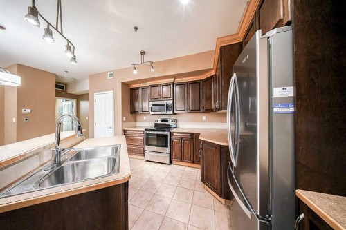 207-5040 53 Street, Sylvan Lake, AB - Indoor Photo Showing Kitchen With Double Sink