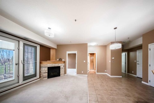 207-5040 53 Street, Sylvan Lake, AB - Indoor With Fireplace