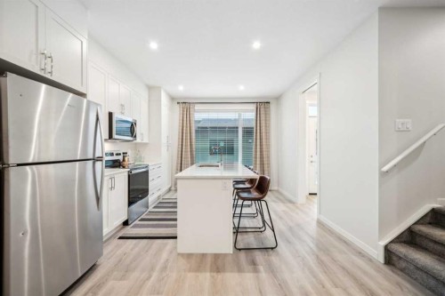 225 Vantage Drive, Cochrane, AB - Indoor Photo Showing Kitchen With Stainless Steel Kitchen