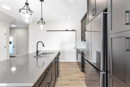 126 Norseman Close, Penhold, AB - Indoor Photo Showing Kitchen With Double Sink With Upgraded Kitchen