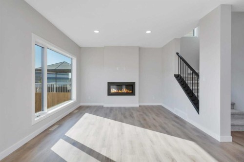 126 Norseman Close, Penhold, AB - Indoor Photo Showing Living Room With Fireplace