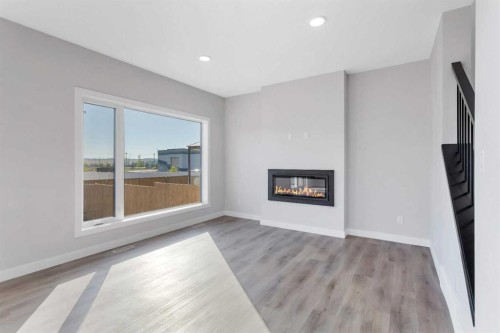 126 Norseman Close, Penhold, AB - Indoor Photo Showing Living Room With Fireplace