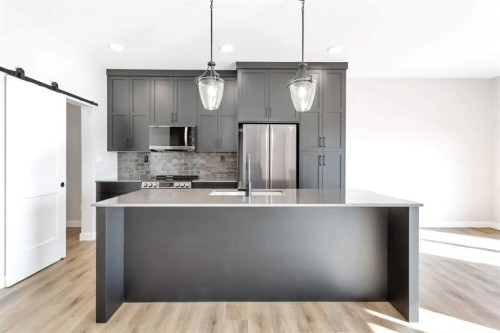 126 Norseman Close, Penhold, AB - Indoor Photo Showing Kitchen With Upgraded Kitchen