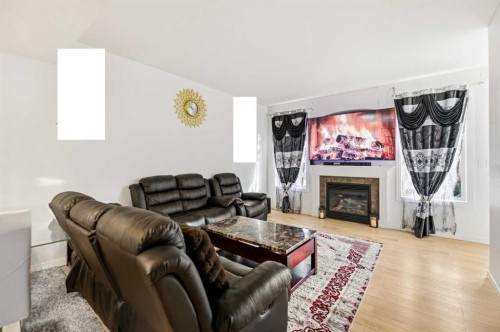 24-45 Ironstone Drive, Red Deer, AB - Indoor Photo Showing Living Room With Fireplace
