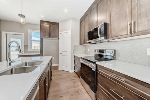 18 Tagish Avenue, Red Deer, AB - Indoor Photo Showing Kitchen With Stainless Steel Kitchen With Double Sink With Upgraded Kitchen