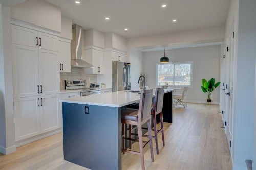 103 Gray Close, Sylvan Lake, AB - Indoor Photo Showing Kitchen With Stainless Steel Kitchen With Upgraded Kitchen