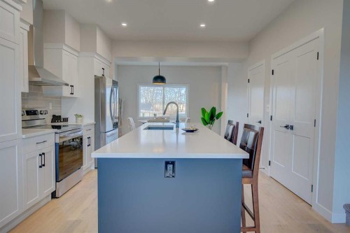 103 Gray Close, Sylvan Lake, AB - Indoor Photo Showing Kitchen With Upgraded Kitchen