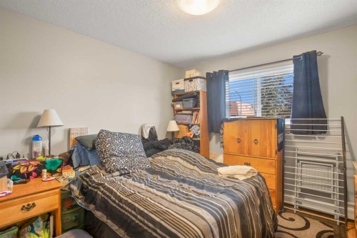 101-304-5904 51 Avenue, Red Deer, AB - Indoor Photo Showing Bedroom
