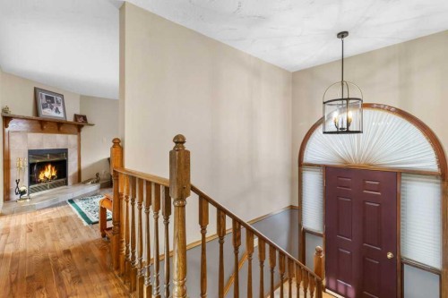 45 Ravenscrag Crescent North, Norglenwold, AB - Indoor With Fireplace
