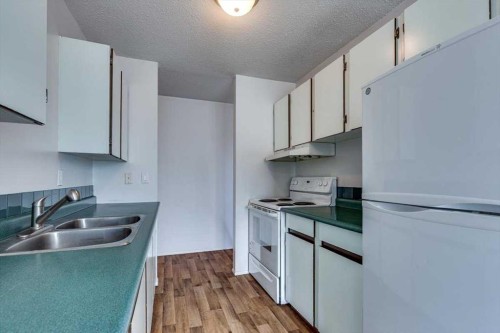 5418 And 5422 48 Avenue, Olds, AB - Indoor Photo Showing Kitchen With Double Sink