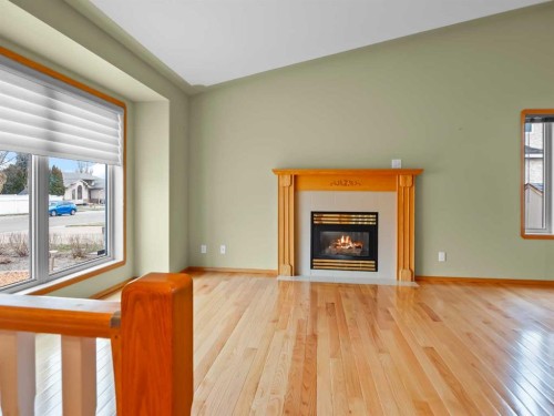 22 Ansett Crescent, Red Deer, AB - Indoor Photo Showing Living Room With Fireplace