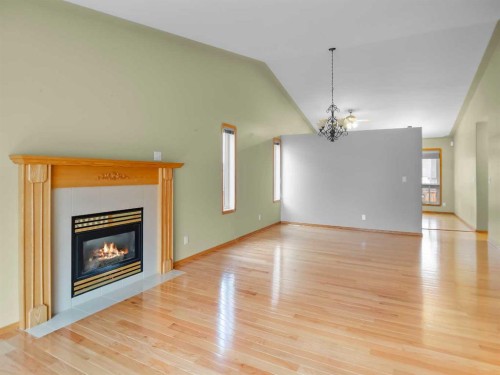 22 Ansett Crescent, Red Deer, AB - Indoor Photo Showing Living Room With Fireplace