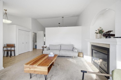 11 Falcon Ridge Drive, Sylvan Lake, AB - Indoor Photo Showing Living Room With Fireplace
