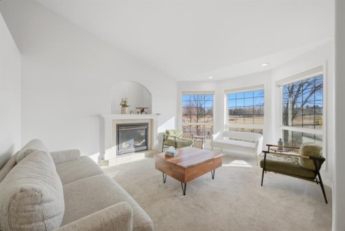 11 Falcon Ridge Drive, Sylvan Lake, AB - Indoor Photo Showing Living Room With Fireplace