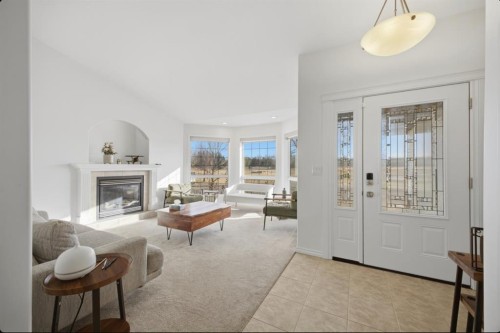 11 Falcon Ridge Drive, Sylvan Lake, AB - Indoor Photo Showing Living Room With Fireplace