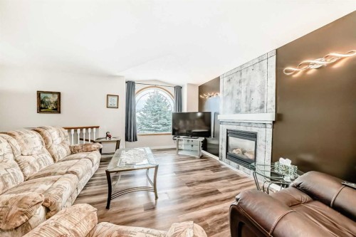 22 Kilburn Crescent, Red Deer, AB - Indoor Photo Showing Living Room With Fireplace