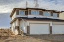 303 Dawson Dock Way, Chestermere, AB  - Outdoor With Facade 