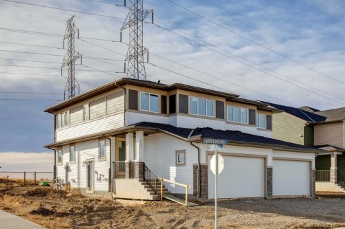 303 Dawson Dock Way, Chestermere, AB - Outdoor With Facade