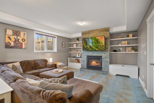 2 Holbrook Place, Sylvan Lake, AB - Indoor Photo Showing Living Room With Fireplace