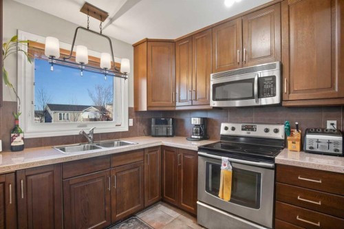 2 Holbrook Place, Sylvan Lake, AB - Indoor Photo Showing Kitchen With Double Sink