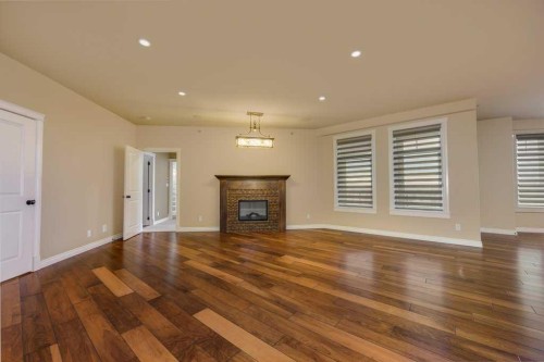 404-5213 61 Street, Red Deer, AB - Indoor Photo Showing Living Room With Fireplace