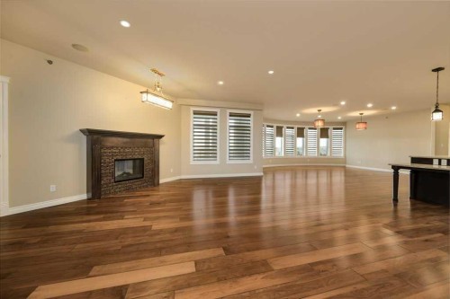 404-5213 61 Street, Red Deer, AB - Indoor Photo Showing Living Room With Fireplace