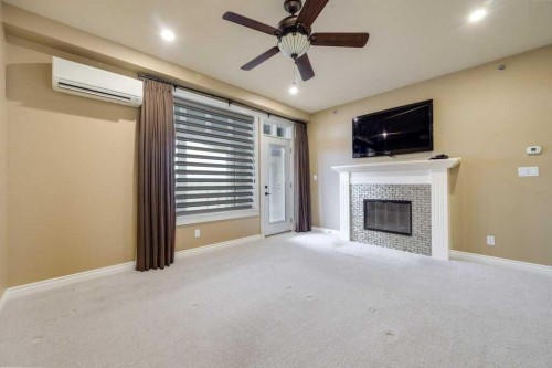 404-5213 61 Street, Red Deer, AB - Indoor With Fireplace