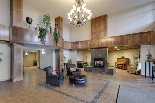 404-5213 61 Street, Red Deer, AB - Indoor With Fireplace