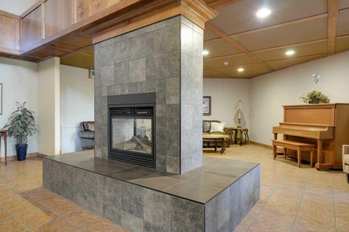 404-5213 61 Street, Red Deer, AB - Indoor With Fireplace