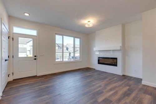 495 Lawthorn Way Se, Airdrie, AB - Indoor Photo Showing Living Room With Fireplace