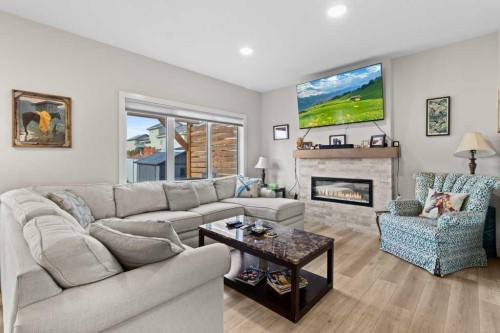 85 Crestview Boulevard, Sylvan Lake, AB - Indoor Photo Showing Living Room With Fireplace