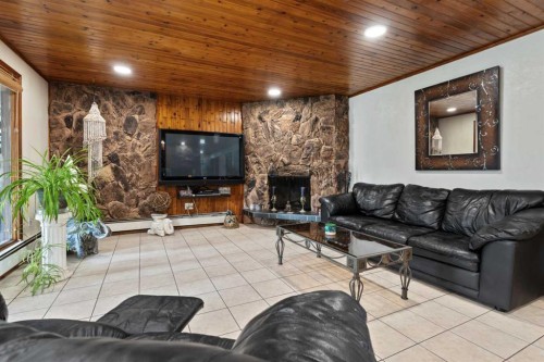 3810 64 Street, Camrose, AB - Indoor Photo Showing Living Room With Fireplace