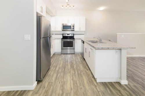 E2-5300 Vista Trail, Blackfalds, AB - Indoor Photo Showing Kitchen With Stainless Steel Kitchen With Double Sink With Upgraded Kitchen