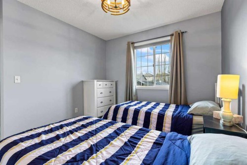 60 Bridlecreek Terrace Sw, Calgary, AB - Indoor Photo Showing Bedroom