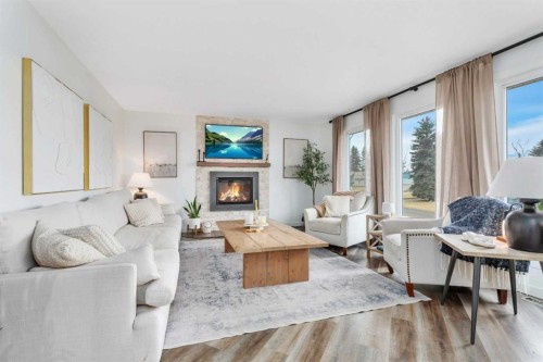 7 Westview Drive, Lacombe, AB - Indoor Photo Showing Living Room With Fireplace