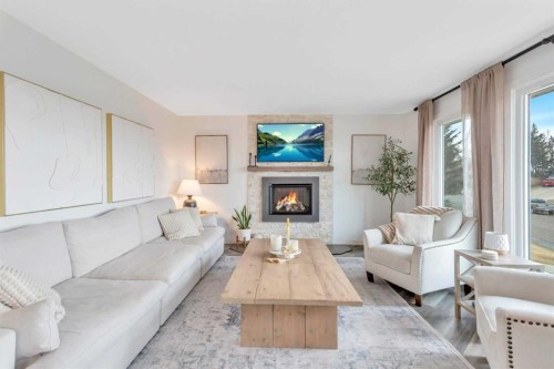 7 Westview Drive, Lacombe, AB - Indoor Photo Showing Living Room With Fireplace