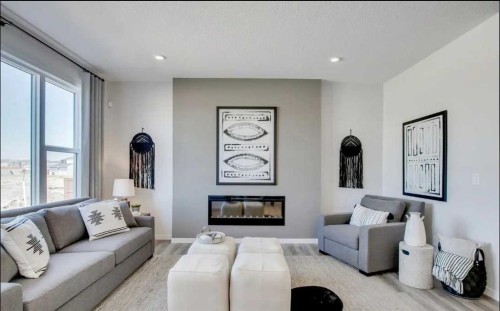89 Creekstone Grove Sw, Calgary, AB - Indoor Photo Showing Living Room With Fireplace